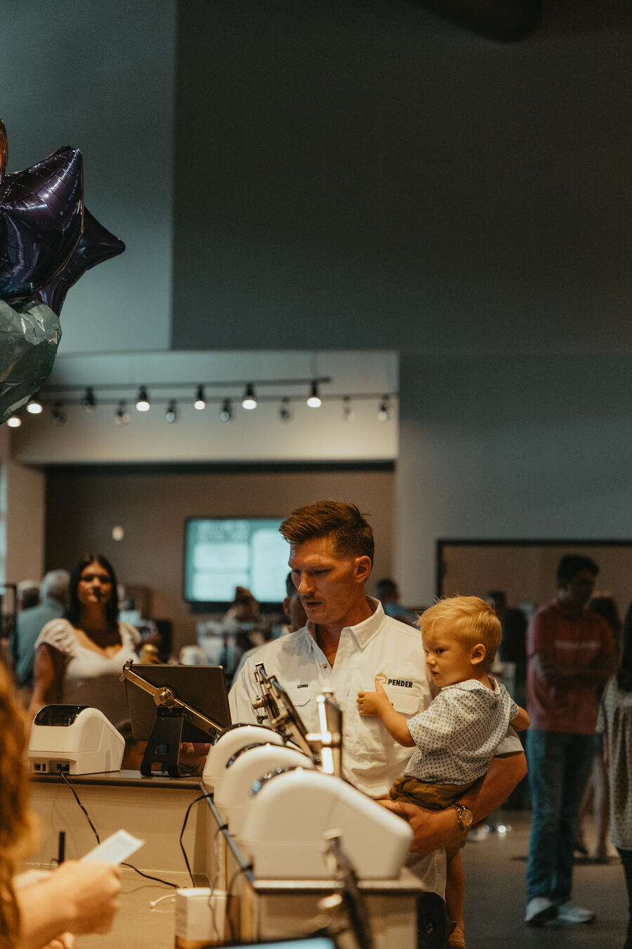 A father and son at the Grovetown welcome desk.