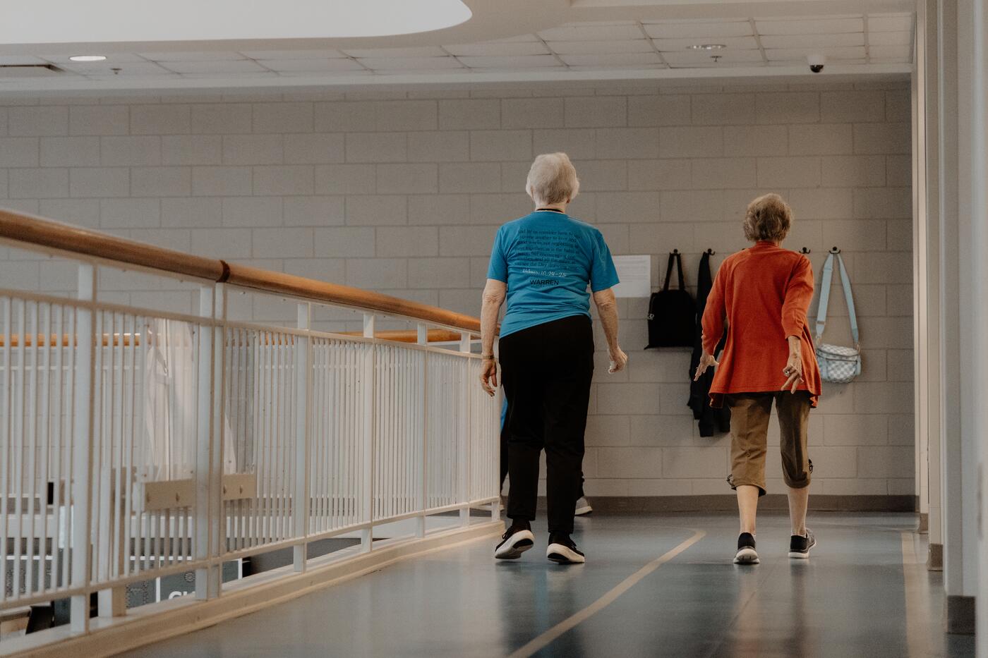 Two members walking the indoor track.